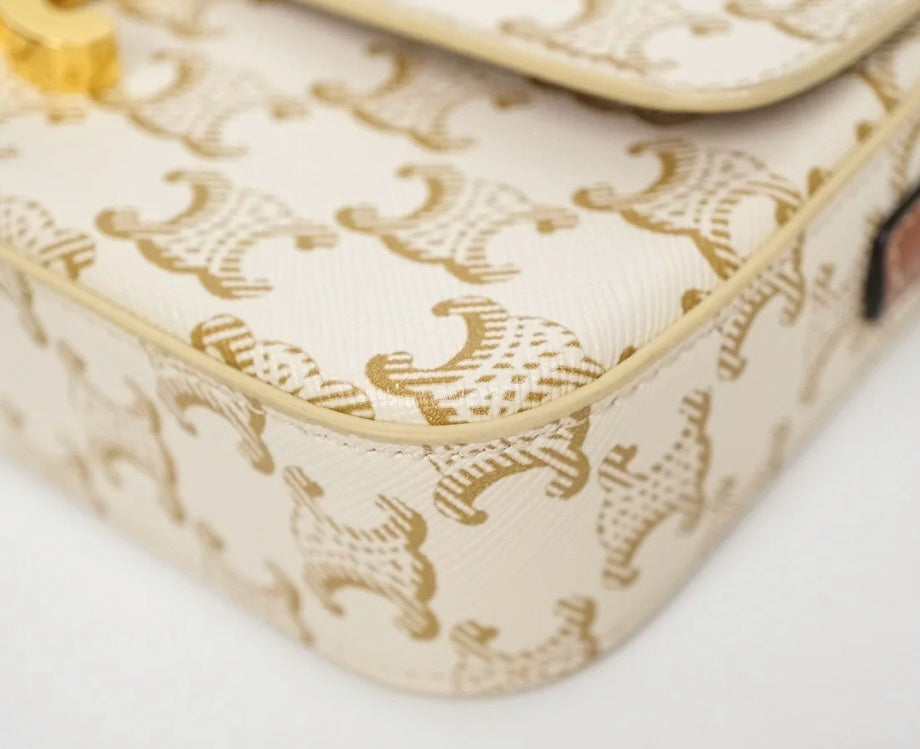 SLG Luxury CELINE Triomphe shoulder bag in white and gold monogram coated canvas with gold-tone hardware detail