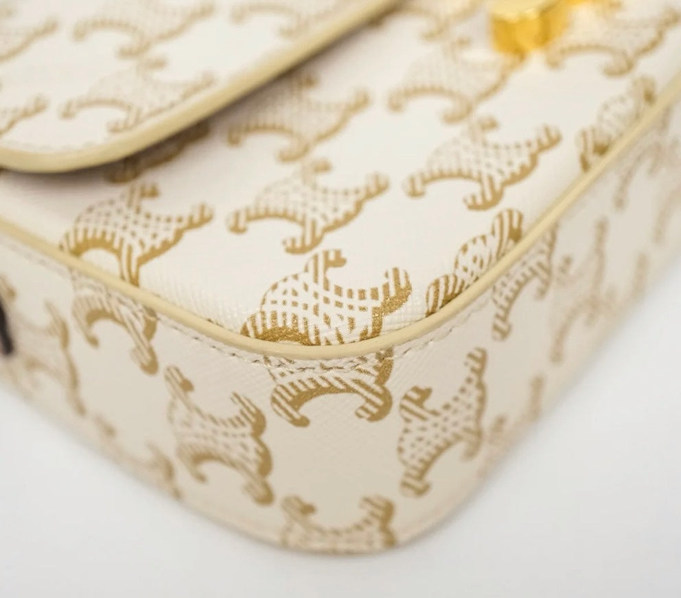 SLG Luxury CELINE Triomphe shoulder bag in white and gold monogram coated canvas with gold-tone hardware detail