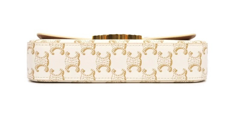 SLG Luxury CELINE Triomphe shoulder bag in white and gold monogram coated canvas with gold-tone metal clasp detail.