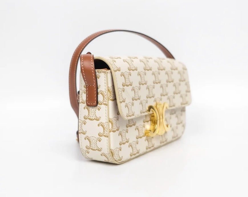 SLG Luxury CELINE Triomphe shoulder bag in white and gold monogram coated canvas with a gold-tone clasp and leather strap