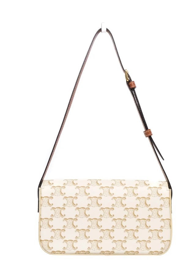 SLG Luxury CELINE Triomphe shoulder bag in white coated canvas with gold monogram print and adjustable leather strap.