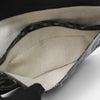 Interior of a black SLG Luxury Goyard Saint Louis tote bag featuring signature chevron canvas and cream fabric lining
