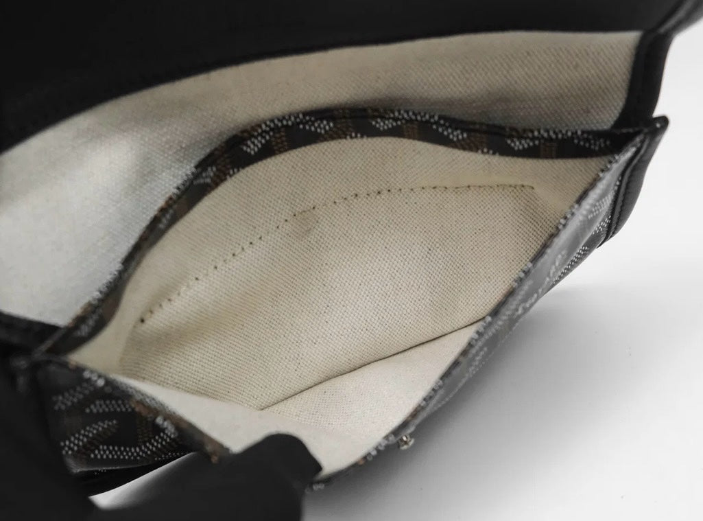 Interior of a black SLG Luxury Goyard Saint Louis tote bag featuring signature chevron canvas and cream fabric lining